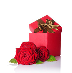 Classic gift box with brown satin bow and bouquet of red roses