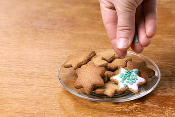 White glaze. Ginger biscuit decoration. Glass plate