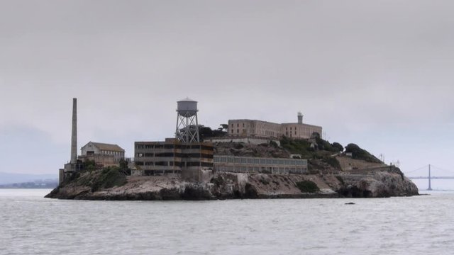 a tracking slow motion shot of the infamous alcatraz island in san francisco bay