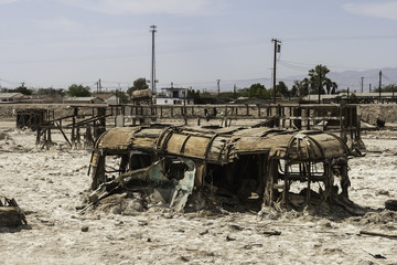 Torn trailer in Salton sea, California