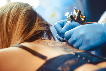 master tattoo woman on her back
