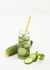 Drink of chopped cucumber and mint on white background