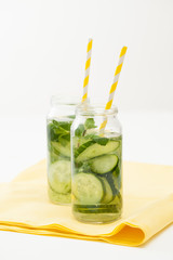 Drink of chopped cucumber and mint on white background