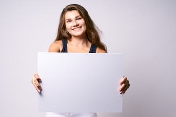 White background. Girl with poster