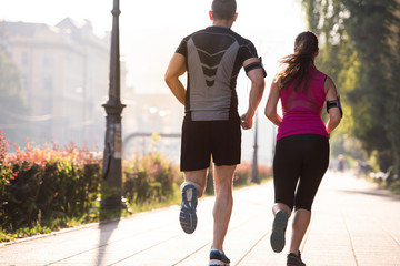 young couple jogging  in the city