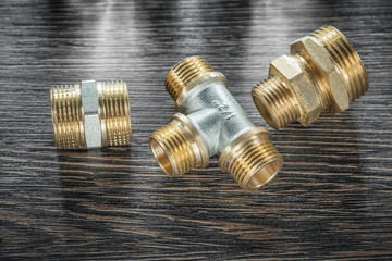 Plumbing brassware on vintage wooden board