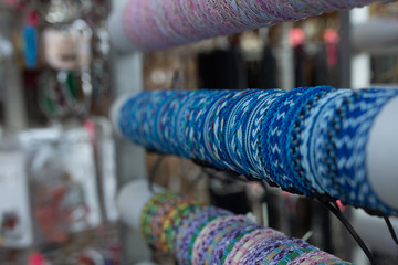 Braided leather bracelets with beads in the store.