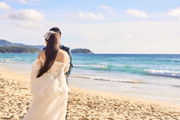 Fototapeta na wymiar Bride and groom. Relax on beach. Wedding