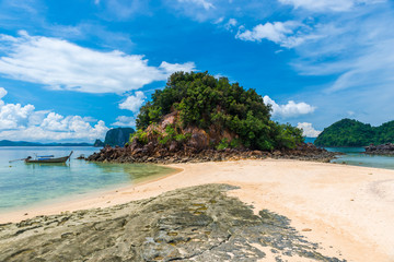 Fototapeta na wymiar landscape on an island with beautiful mountains and rocks, a boat near the beach of the island