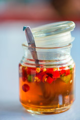 pot with olive oil and pickled chili