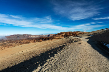 Teide National Park, Tenerife, Canary Islands - Gravel footpath of the Montana Blanca volcanic ascent trail. This scenic hiking path leads up to the 3718 m Teide Peak, the highest peak in Spain.