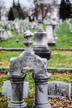 Daytime shallow depth of field picture of grave marker headstone in Mt. Hope cemetery in Rochester, New York