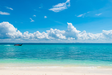 Fototapeta premium wooden boat long tail in the azure sea near the island of Poda, Thailand