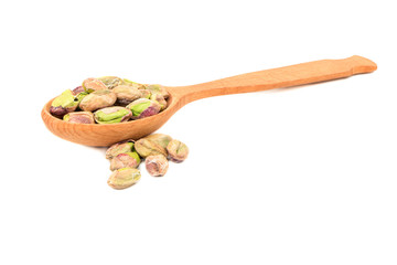 Pistachio nuts without shell in spoon