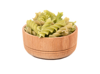 Green pasta fusilli in bowl