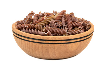 Dark fussili pasta in bowl