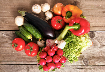 salad from fresh vegetables in a plate on a table, selective focus