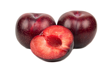 Fototapeta na wymiar Red plum with half