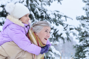 grandmother with granddaughter smiling