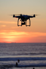 Fototapeta na wymiar Drone Flying at sunset moment