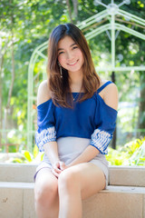Beautiful young adult thai chinese blue tank top relax and smile