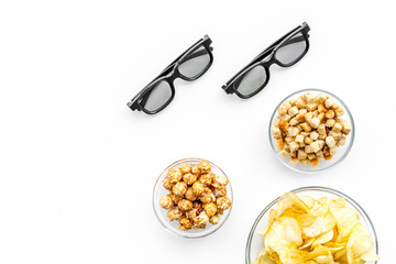 Fast food for watching film. Crisps, popcorn, rusks near glasses on white background top view copyspace