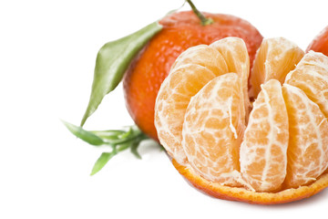 Mandarin or Tangerine fruit with leaves on a white background