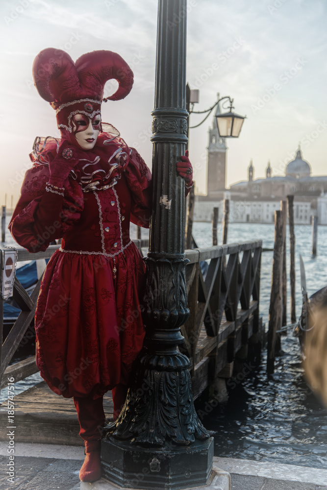 Wall mural people in masks and costumes on venetian carnival