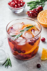 Fresh cranberry citrus pomegranate festive drink. Selective focus, copy space.