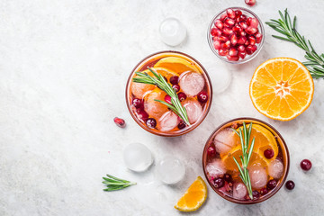 Festive cranberry citrus pomegranate cocktail. Top view, space for text.