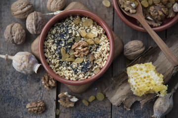 traditional Christmas dish of Slavs - kutya on the wooden background with poppy seeds and welnuts 