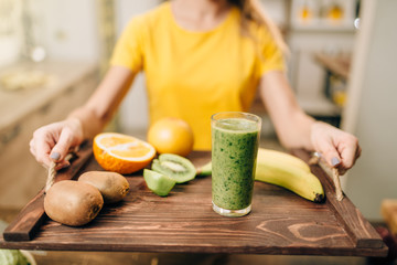 Female person with cocktail, fruits and vegetables