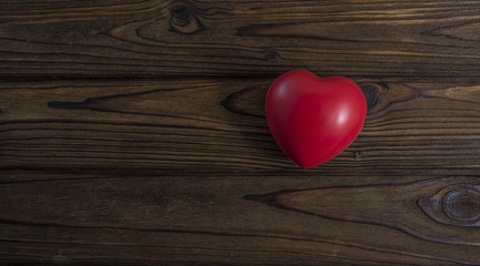 red heart donor on a wooden background. With space for text of your design, advertising