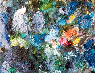 Closeup colorful of oil color on palette of artist