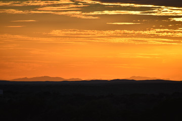 Fototapeta na wymiar Orange Sunset In the Mountains