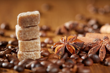 Aroma coffee chocolate cookies and spices on the wooden table. Dark wooden background. Top view. Close. Closeup.