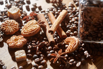 Aroma coffee chocolate cookies and spices on the wooden table. Dark wooden background. Top view. Close. Closeup.