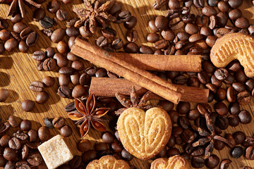 Aroma coffee chocolate cookies and spices on the wooden table. Dark wooden background. Top view. Close. Closeup.