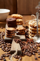 Aroma coffee candy chocolate cookies and spices on the wooden table. Christmas sweets. Dark wooden background. Top view. Close. Closeup.