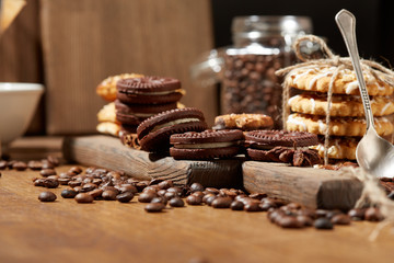 Aroma coffee candy chocolate cookies and spices on the wooden table. Christmas sweets. Dark wooden background. Top view. Close. Closeup.