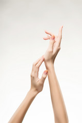 beautiful woman's hands with light pink manicure on the nails