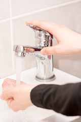 woman washing her hands