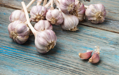 violet garlic on a wooden background