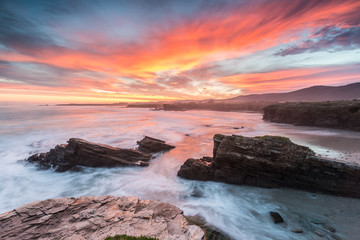 colored winter sunrise on the Galician coast, on the Las Islas beach