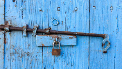 Wooden bright blue, old and peeled background. Close up view with details.