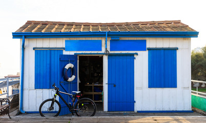 Small house with blue windows and door at Larnaca, Cyprus. Close up view with details.
