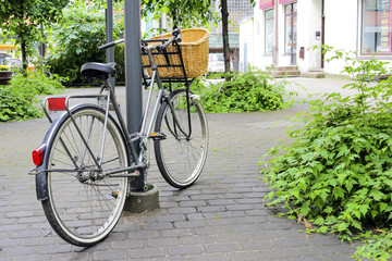 Fototapeta na wymiar Bicycle near a pole in the park
