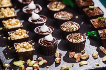 chocolate sweets on black background