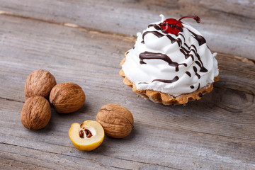  a cake with cream on a  wooden background