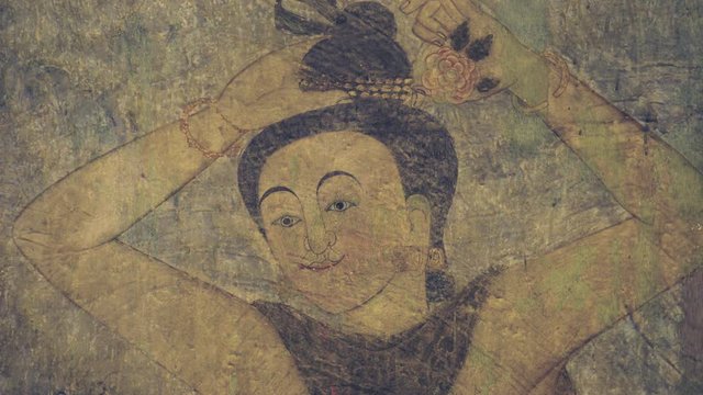 mural painting portrait of a woman looking forward close up shot